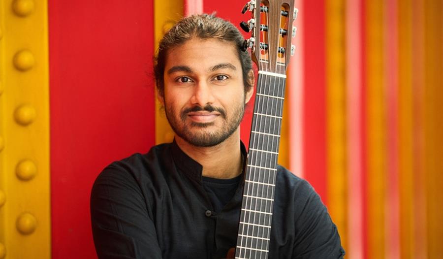 Samrat Majumder posed with guitar