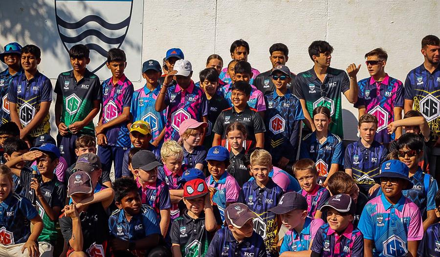 A group of boys and girls in all their team kits for C6