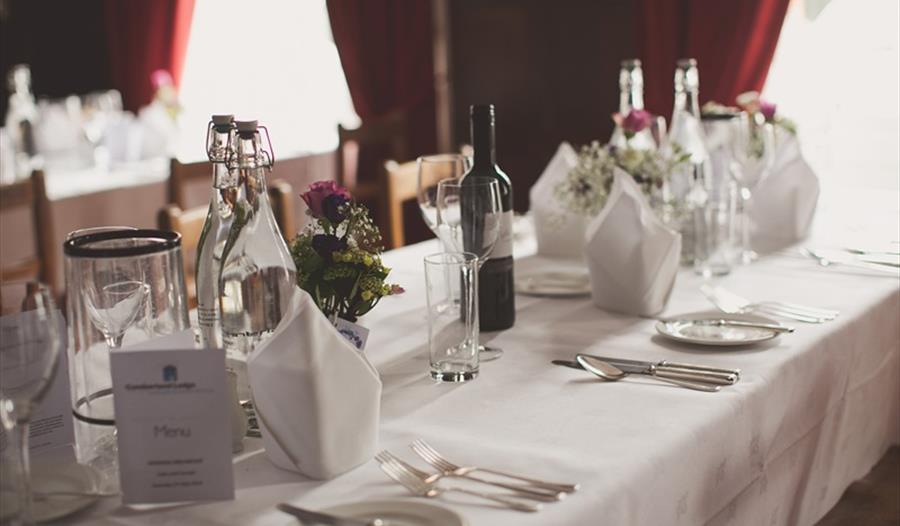 Table with wine, plates and cutlery