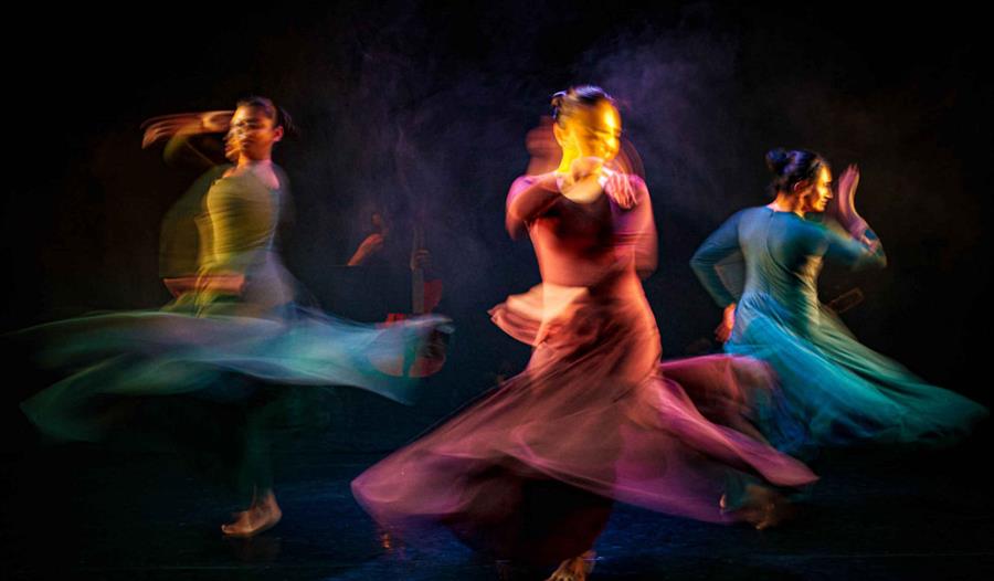 Three people dancing