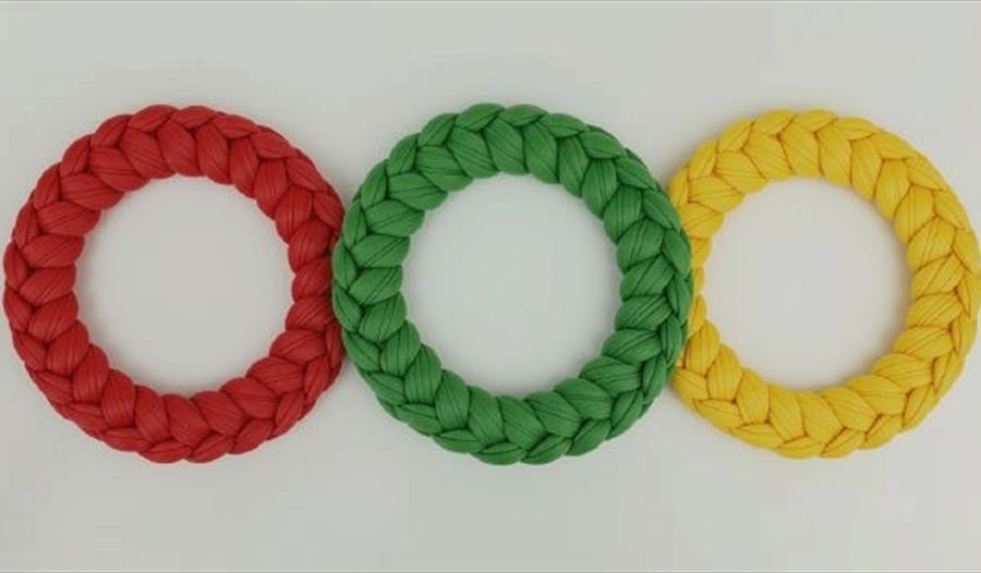 Three knitted Christmas wreaths