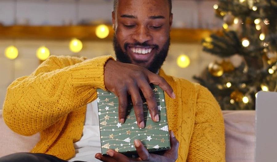 Man opening a gift
