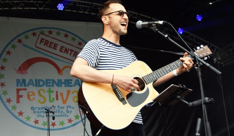 Person playing guitar and singing
