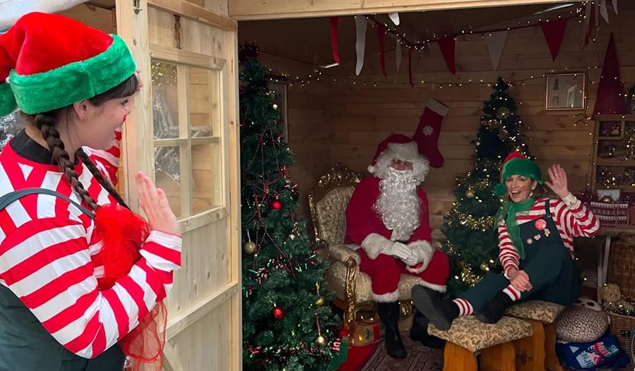 Father Christmas and elves in the grotto