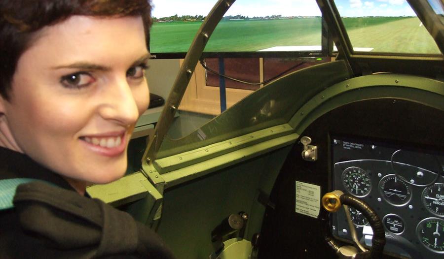 Woman in Spitfire Simulator at Maidenhead Heritage Centre