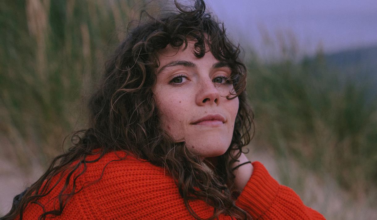 Ellie Gowers - at the beach, red jumper - ©Emilie Cotterill Hires