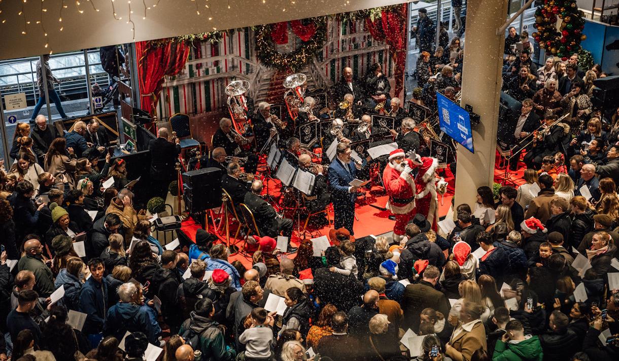 Howden Christmas Racing Weekend at Ascot | people carol singing with Ascot Brass Band