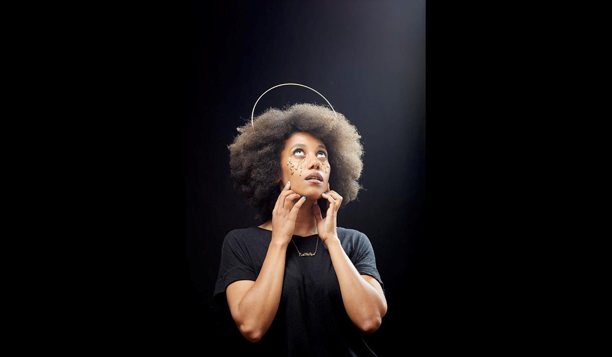 Kate Cheka ©bennyjjohnson - lady looking up all in black with a halo