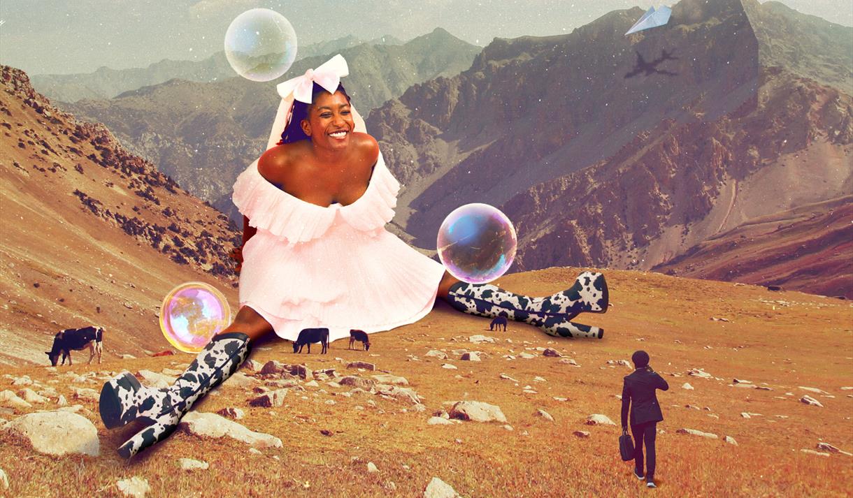 Giant Sophie Duker sat on a mountainside