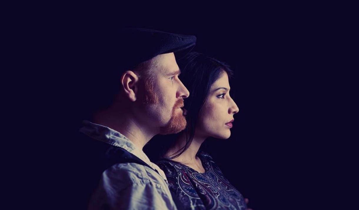 Tomorrow Bird - man and woman in profile, silhouetted on dark background