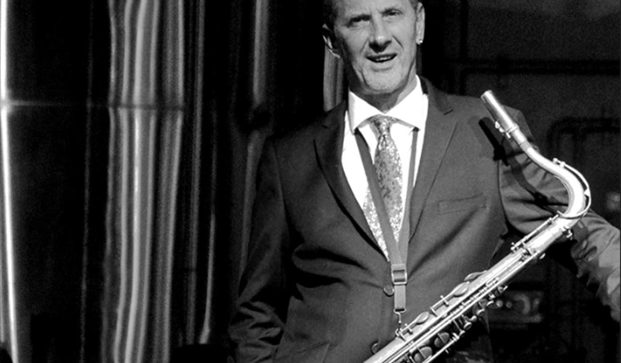 Benn - black and white, suited with saxophone