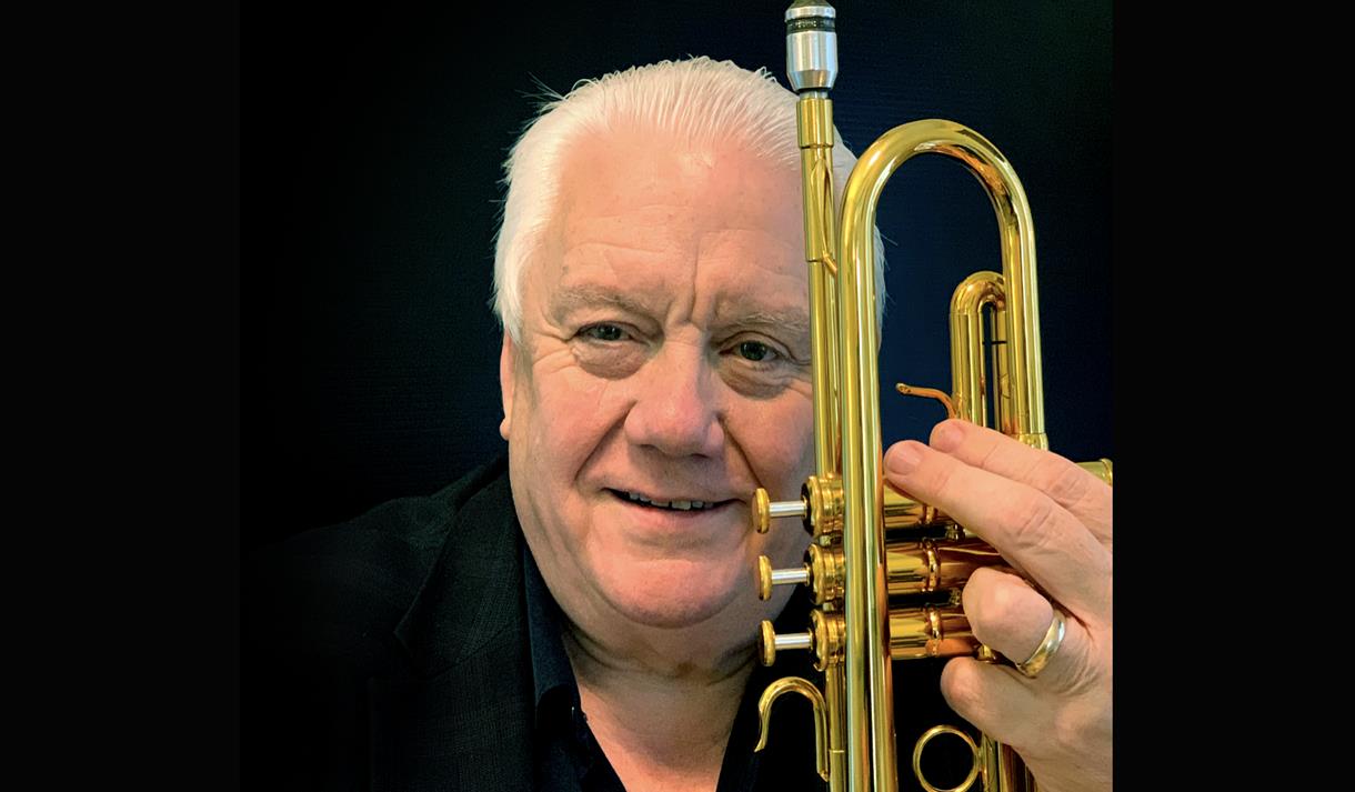 Bruce Adams - holding a trumpet