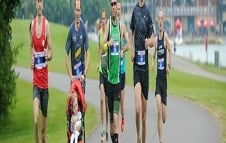 Group running with pushchair by Dorney Lake