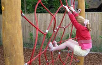Child in play area at Cliveden