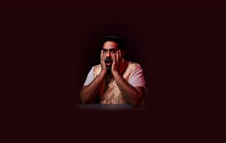 Man holding his face - Eshaan Akbar: Can’t Get No Satisfakshaan