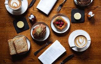 pastries, toast, butter, jam and coffee as part of Hinds Head coffee morning