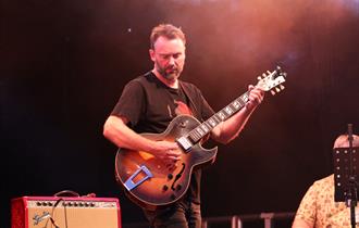 Hugh Turner playing guitar