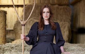 Kate Norris in a barn