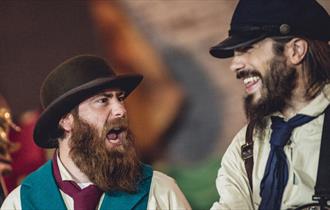 Old Time Sailors - two bearded men in traditional clothing singing