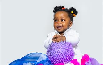 Soft or Spiky - Young girl playing with toys and cloth - ©Steve Gregson