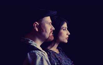 Tomorrow Bird - man and woman in profile, silhouetted on dark background
