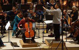 W&MSO - The orchestra rehearsing for a concert at Eton College School Hall.