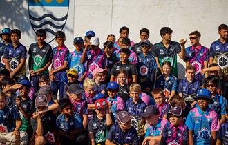 A group of boys and girls in all their team kits for C6