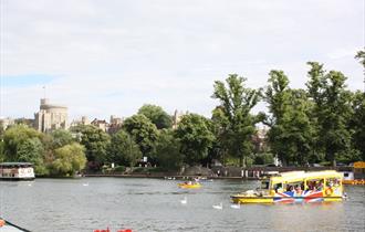 Windsor Duck Tours on River Thames with Windsor Castle in distance