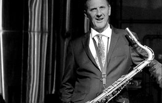 Benn - black and white, suited with saxophone