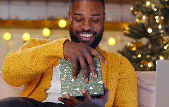 Man opening a gift