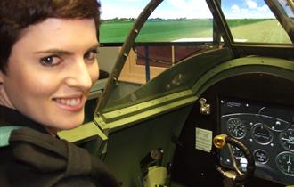 Woman in Spitfire Simulator at Maidenhead Heritage Centre