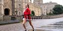 Alexander Devine Santa Dash | participant running past Windsor Castle
