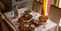 An oriental dinner feast for two, complete with two glasses of wine