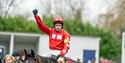 Triumphant jockey and racehorse at Royal Windsor Racecourse