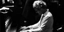 Alex Hutton - Playing piano, black and white