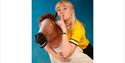 Becky Umbers - piggybacking a man in a rubber horse head mask