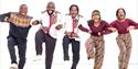 Black Umfolosi dancing arms linked
