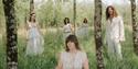 Bryony Dunn and the Forest - band in traditional white clothing out in the woods