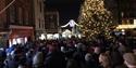 Carols on the Hill - crowd singing around the Christmas tree and with military band, Christmas lights in background