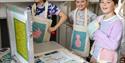 Young girls doing screen printing