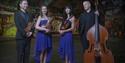Graffiti Classics - formally dressed string quartet standing in front of urban wall - ©David Pickens