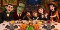 Children dressed in Halloween costumes with Halloween characters round the table at The Ivy