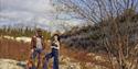 Hannah Sanders & Ben Savage 2025 - posed in nature with a guitar