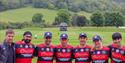 Team posing in their kit