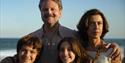 I'm Still Here - Family smiling except for Mother at beach