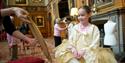 Young girl taking part in costume activity at Windsor Castle.  Royal Collection Trust / © His Majesty King Charles III 2023