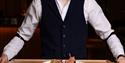 Waiter holding a tray of food