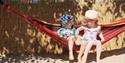 Two small children in a hammock at Maidenhead Beach