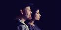 Tomorrow Bird - man and woman in profile, silhouetted on dark background