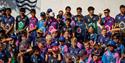 A group of boys and girls in all their team kits for C6